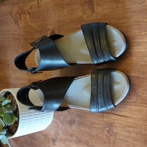 EARTH Black leather wedge heel sandals.